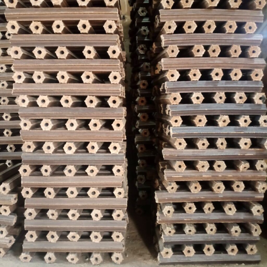 Biomass briquettes stacked in the Geetee Energy warehouse
